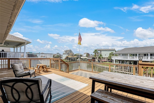 1114 Tiki Dr, Galveston, TX 77554 - deck featuring a water view and a residential view