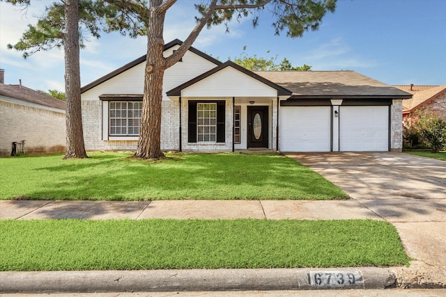 16739 Sky Blue Ln, Houston, TX 77095 - view of front of home featuring a garage, concrete driveway, and a front yard