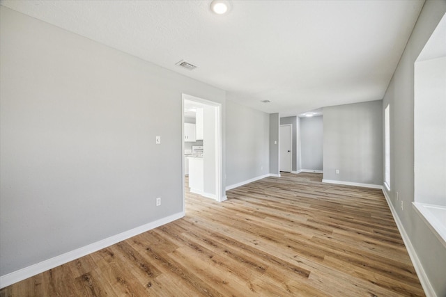 16739 Sky Blue Ln, Houston, TX 77095 - empty room featuring light wood-style floors and baseboards