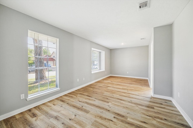 16739 Sky Blue Ln, Houston, TX 77095 - spare room featuring light wood-type flooring and baseboards
