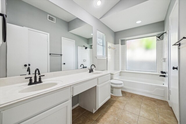 16739 Sky Blue Ln, Houston, TX 77095 - bathroom featuring shower / bathtub combination, double vanity, toilet, tile patterned flooring, and recessed lighting