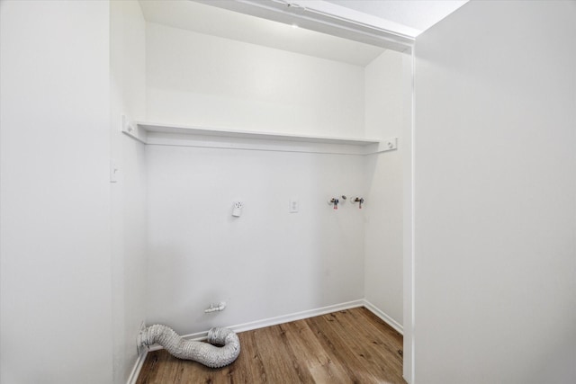 16739 Sky Blue Ln, Houston, TX 77095 - washroom featuring wood finished floors, baseboards, and hookup for a washing machine