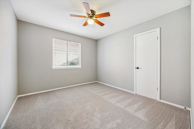 16739 Sky Blue Ln, Houston, TX 77095 - unfurnished room featuring carpet flooring, a ceiling fan, and baseboards