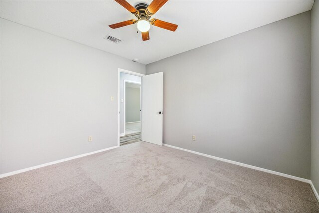 16739 Sky Blue Ln, Houston, TX 77095 - unfurnished room featuring carpet floors, baseboards, and ceiling fan