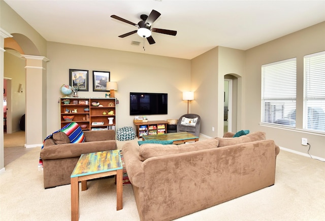 711 Shenandoah Falls Ln, Rosenberg, TX 77469 - living room featuring arched walkways, carpet floors, and decorative columns
