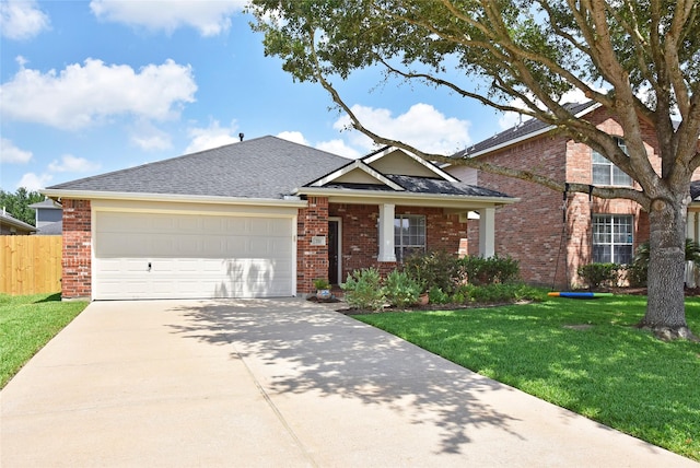 711 Shenandoah Falls Ln, Rosenberg, TX 77469 - view of front of home with driveway, an attached garage, brick siding, and roof with shingles