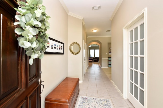 711 Shenandoah Falls Ln, Rosenberg, TX 77469 - corridor featuring arched walkways, ornamental molding, light tile patterned flooring, and baseboards