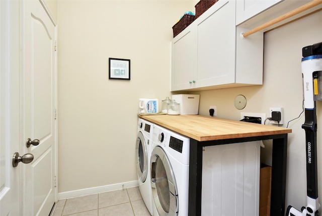 711 Shenandoah Falls Ln, Rosenberg, TX 77469 - laundry area with cabinet space, baseboards, light tile patterned flooring, and independent washer and dryer