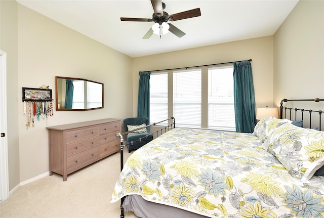 711 Shenandoah Falls Ln, Rosenberg, TX 77469 - bedroom with light colored carpet, baseboards, and a ceiling fan