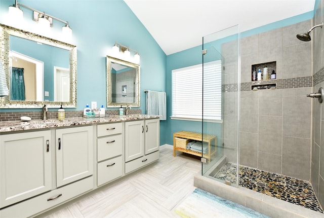 711 Shenandoah Falls Ln, Rosenberg, TX 77469 - full bath featuring vaulted ceiling, a stall shower, and double vanity