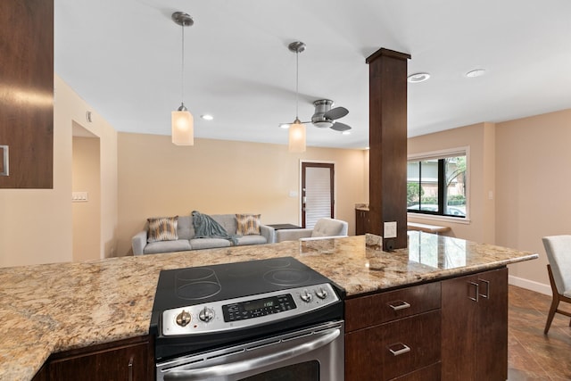6401 Bayou Glen Rd, Houston, TX 77057 - kitchen with stainless steel range with electric cooktop, dark brown cabinets, dark tile patterned floors, open floor plan, and a ceiling fan