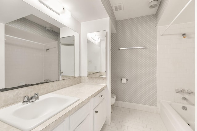 3131 Cummins St Unit 50, Houston, TX 77027 - full bathroom with tile patterned flooring, vanity, toilet,  shower combination, and baseboards