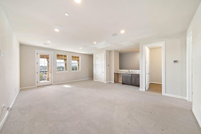 821 Dunleigh Meadows Ln, Houston, TX 77055 - unfurnished living room with light colored carpet, recessed lighting, and attic access