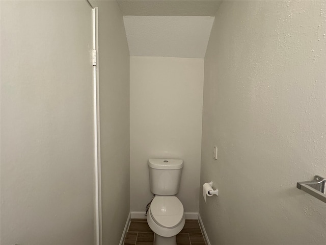 6500 Sands Point Dr Unit 114, Houston, TX 77074 - bathroom featuring toilet, baseboards, and wood finished floors