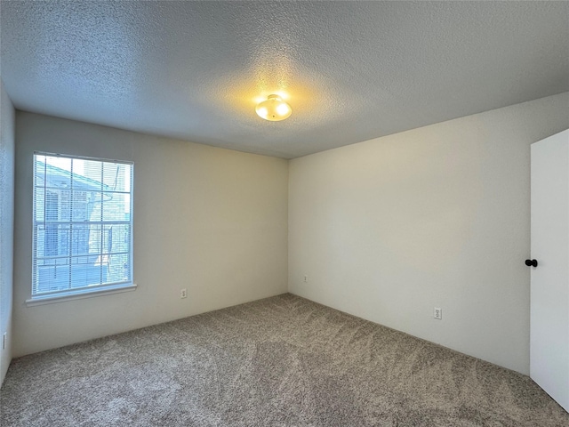 6500 Sands Point Dr Unit 114, Houston, TX 77074 - carpeted spare room with a textured ceiling