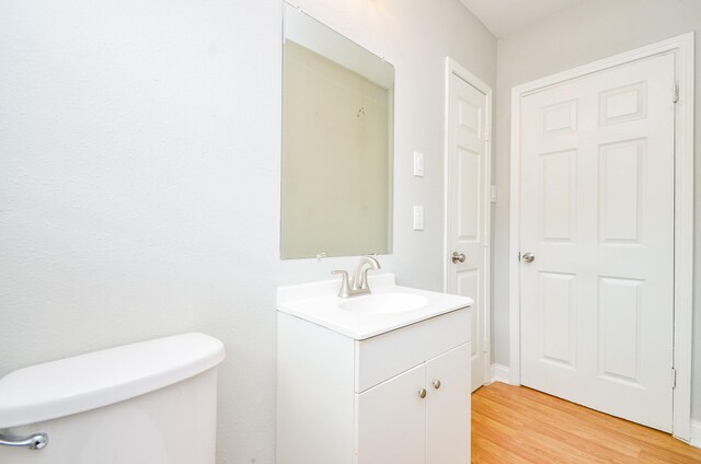 4514 Keystone St, Houston, TX 77021 - bathroom featuring toilet, vanity, and wood finished floors
