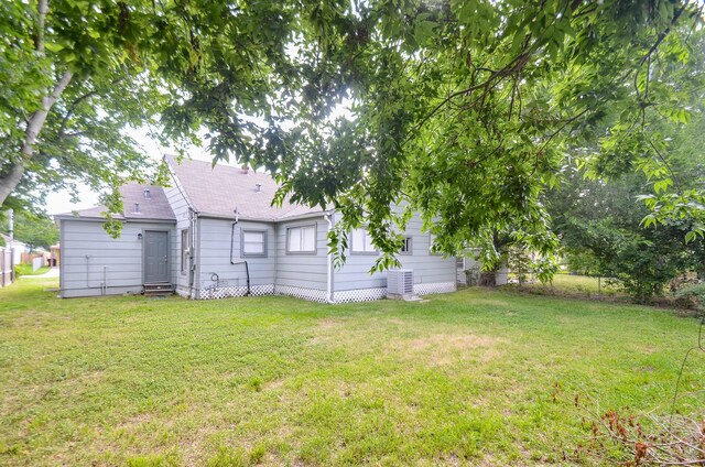 4514 Keystone St, Houston, TX 77021 - view of green lawn featuring entry steps and cooling unit