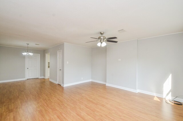 4514 Keystone St, Houston, TX 77021 - unfurnished living room with light wood-style floors, a chandelier, a ceiling fan, baseboards, and crown molding