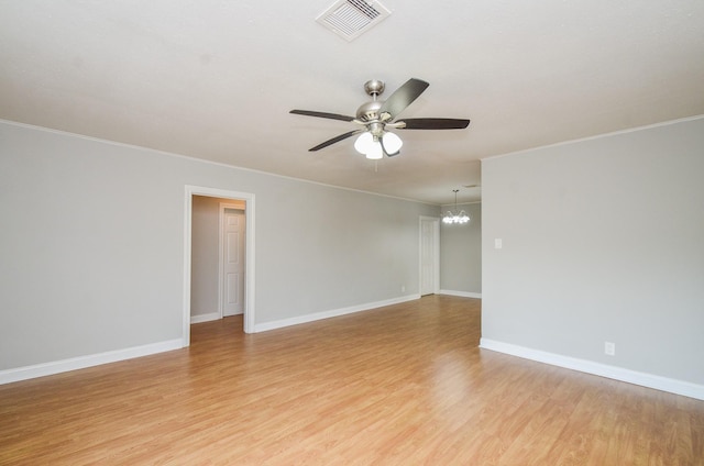 4514 Keystone St, Houston, TX 77021 - unfurnished room with a chandelier, ceiling fan, light wood-style floors, crown molding, and baseboards