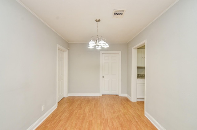 4514 Keystone St, Houston, TX 77021 - unfurnished dining area featuring a chandelier, light wood-style floors, ornamental molding, and baseboards