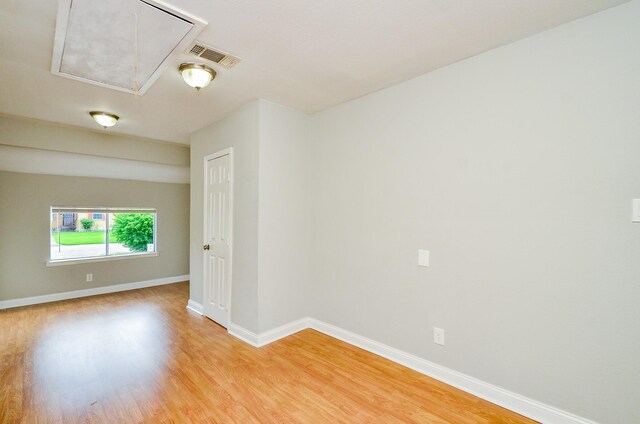 4514 Keystone St, Houston, TX 77021 - unfurnished room with attic access, light wood-type flooring, and baseboards