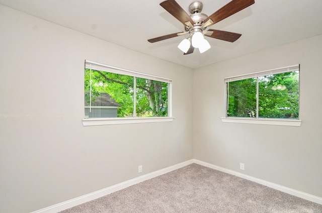 4514 Keystone St, Houston, TX 77021 - carpeted spare room with plenty of natural light, baseboards, and ceiling fan