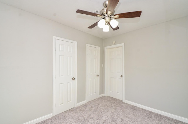 4514 Keystone St, Houston, TX 77021 - unfurnished bedroom featuring light colored carpet, baseboards, and a ceiling fan
