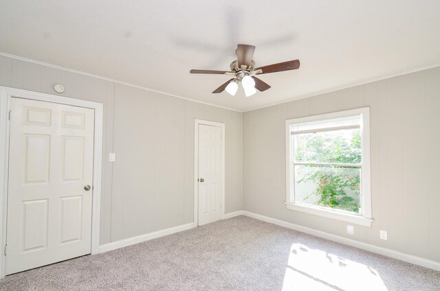 4514 Keystone St, Houston, TX 77021 - unfurnished room featuring carpet floors, crown molding, a ceiling fan, baseboards, and a smoke detector