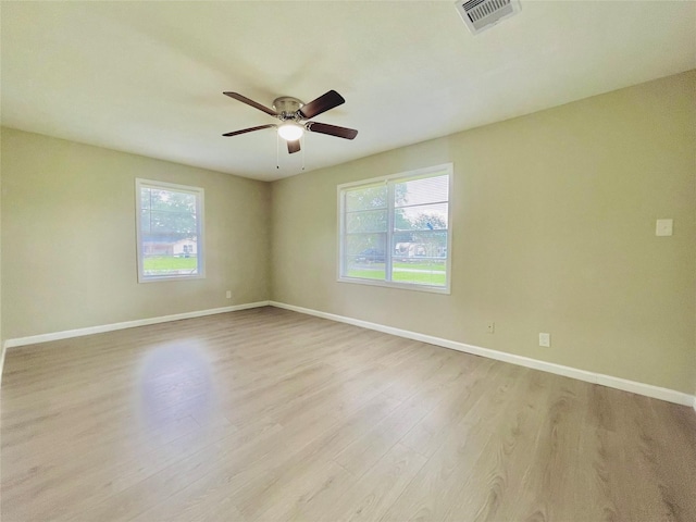 105 Cornelia St, Sweeny, TX 77480 - empty room with healthy amount of natural light, light wood finished floors, and baseboards