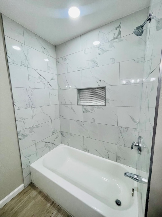 105 Cornelia St, Sweeny, TX 77480 - bathroom with wood finished floors, shower / bathtub combination, and baseboards