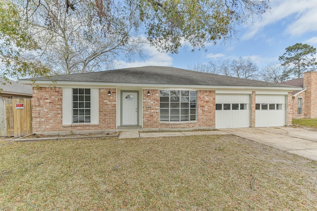 12523 Drifting Winds Dr, Houston, TX 77044 - ranch-style house with a garage, concrete driveway, brick siding, and roof with shingles