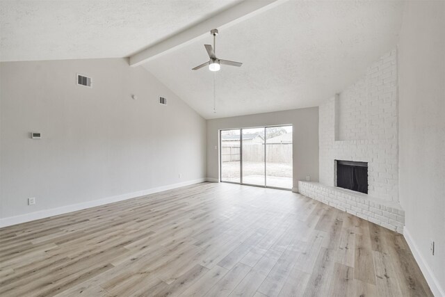 12523 Drifting Winds Dr, Houston, TX 77044 - unfurnished living room with light wood-style floors, a ceiling fan, a brick fireplace, and baseboards