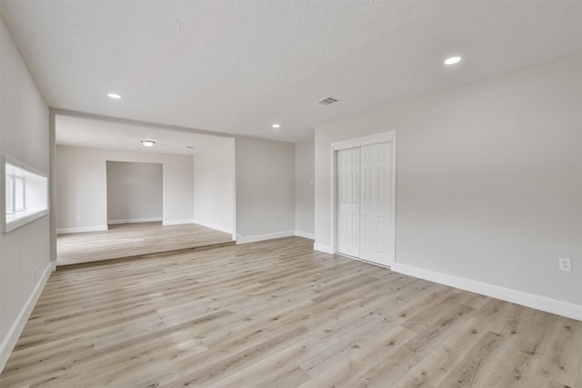12523 Drifting Winds Dr, Houston, TX 77044 - unfurnished room featuring light wood-style floors, recessed lighting, and baseboards