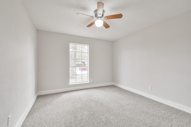 12523 Drifting Winds Dr, Houston, TX 77044 - carpeted empty room with a ceiling fan, baseboards, and a textured ceiling