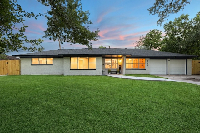 1301 Gulf St, Pasadena, TX 77502 - back of property with a garage, concrete driveway, and brick siding