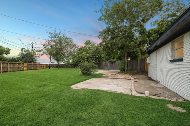 1301 Gulf St, Pasadena, TX 77502 - yard at dusk featuring a patio area
