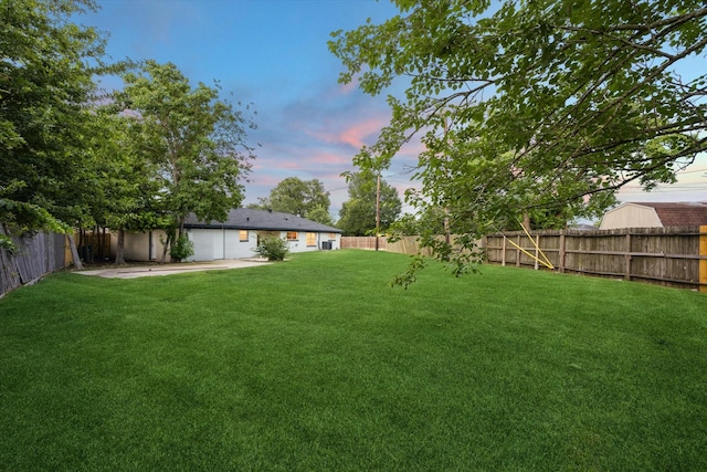 1301 Gulf St, Pasadena, TX 77502 - fenced backyard with a patio area