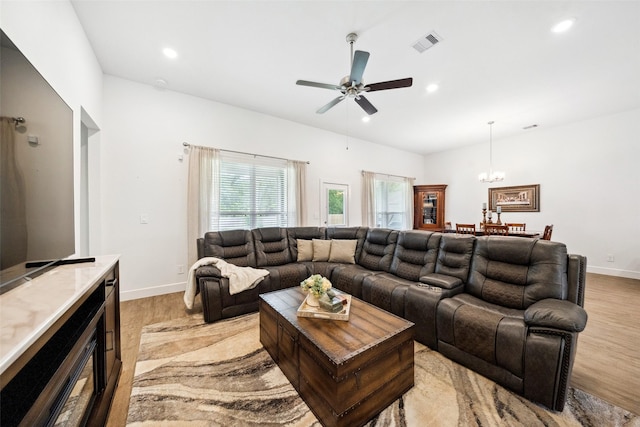 6006 Hazel Place Dr, Conroe, TX 77303 - living room with light wood-style flooring, recessed lighting, baseboards, ceiling fan, and a chandelier