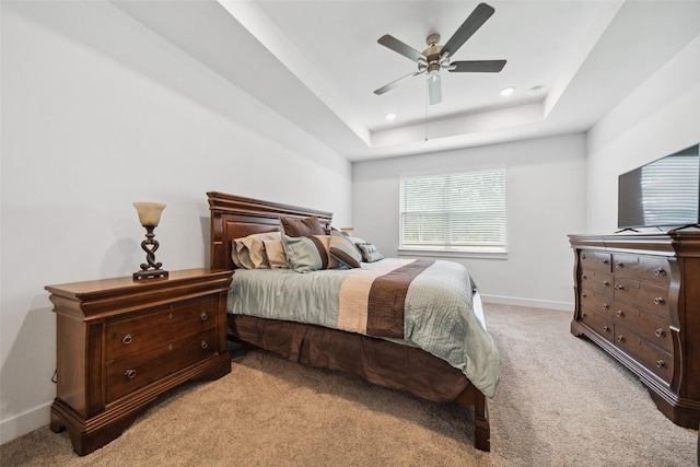6006 Hazel Place Dr, Conroe, TX 77303 - bedroom featuring light colored carpet, baseboards, a tray ceiling, a ceiling fan, and recessed lighting