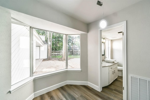 3522 Creekbriar Dr, Houston, TX 77068 - unfurnished dining area with dark wood-type flooring and baseboards