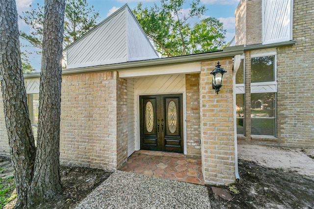 3522 Creekbriar Dr, Houston, TX 77068 - view of exterior entry with brick siding and a chimney