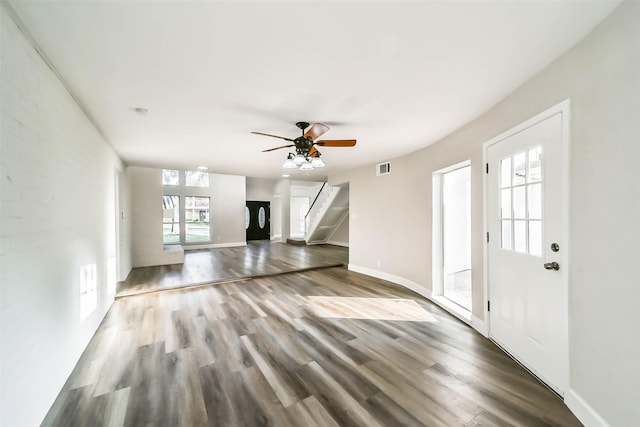 3522 Creekbriar Dr, Houston, TX 77068 - unfurnished living room featuring wood finished floors, ceiling fan, baseboards, and stairs