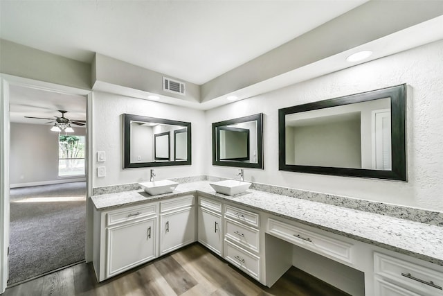 3522 Creekbriar Dr, Houston, TX 77068 - bathroom with double vanity, wood finished floors, and ceiling fan