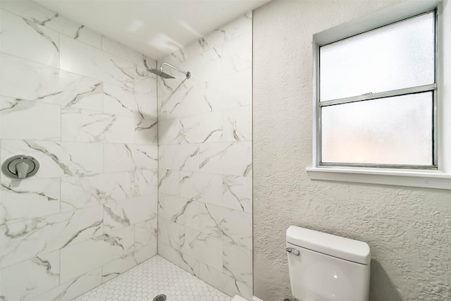 3522 Creekbriar Dr, Houston, TX 77068 - bathroom featuring a tile shower, toilet, and a textured wall