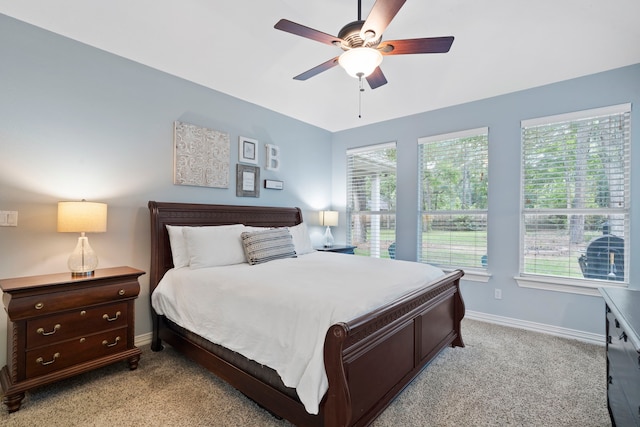 15 Rose Pine Ct, Magnolia, TX 77355 - bedroom featuring light carpet, baseboards, and ceiling fan