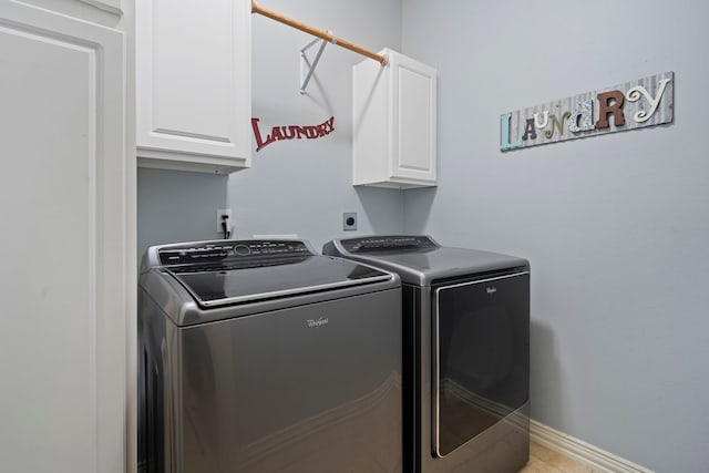 15 Rose Pine Ct, Magnolia, TX 77355 - laundry room with cabinet space, washer and clothes dryer, and baseboards