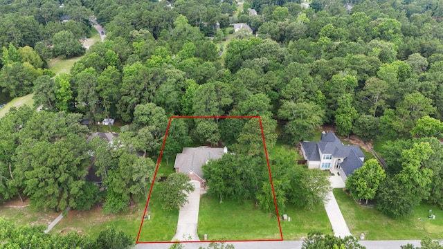 15 Rose Pine Ct, Magnolia, TX 77355 - aerial view of property's location featuring a heavily wooded area and property boundaries highlighted