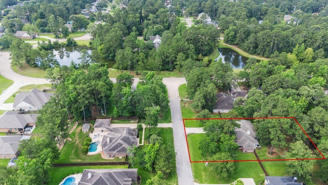15 Rose Pine Ct, Magnolia, TX 77355 - aerial view of residential area with a large body of water and property parcel outlined
