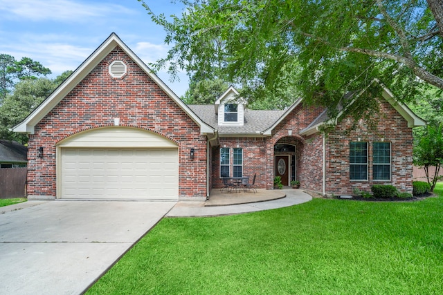 15 Rose Pine Ct, Magnolia, TX 77355 - traditional home with concrete driveway, a front yard, brick siding, an attached garage, and a shingled roof
