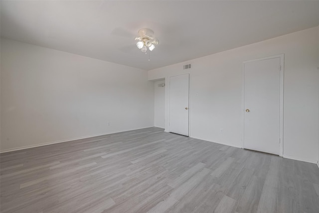 6103 Fondren Rd Unit 7, Houston, TX 77036 - unfurnished bedroom featuring light wood finished floors, baseboards, and ceiling fan